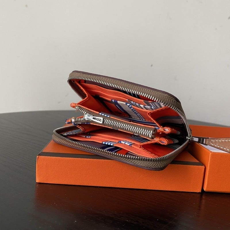 本革ラウンドファスナー二つ折り財布 リバーシブル エプソン革　黒 オレンジ 白 ブルー