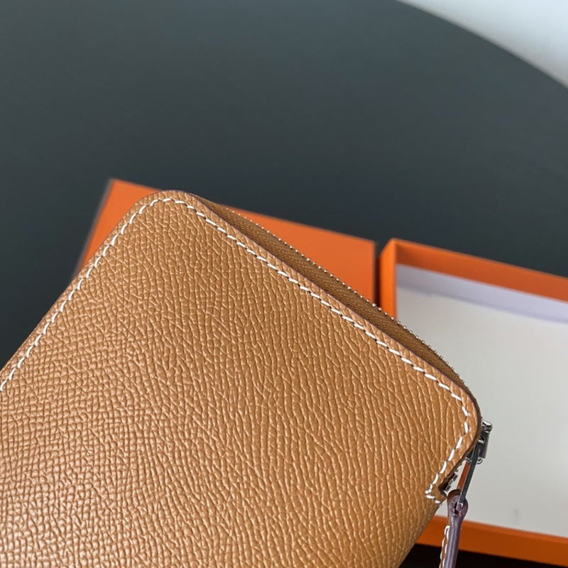 本革ラウンドファスナー二つ折り財布 リバーシブル エプソン革　黒 オレンジ 白 ブルー